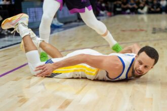 Jan 25, 2026; Minneapolis, Minnesota, USA; Golden State Warriors guard Stephen Curry (30) falls to the court agains the Minnesota Timberwolves in the fourth quarter at Target Center. Mandatory Credit: Matt Blewett-Imagn Images