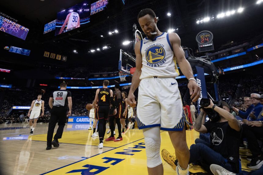 Jan 11, 2026; San Francisco, California, USA; Golden State Warriors guard Stephen Curry (30) grimaces after being fouled by the Atlanta Hawks during the fourth quarter at Chase Center. Mandatory Credit: D. Ross Cameron-Imagn Images