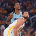 Apr 15, 2025; San Francisco, California, USA; Golden State Warriors guard Stephen Curry (30) stands in front of Memphis Grizzlies guard Ja Morant (12) during a jump ball in the first quarter at the Chase Center. Mandatory Credit: Cary Edmondson-Imagn Images