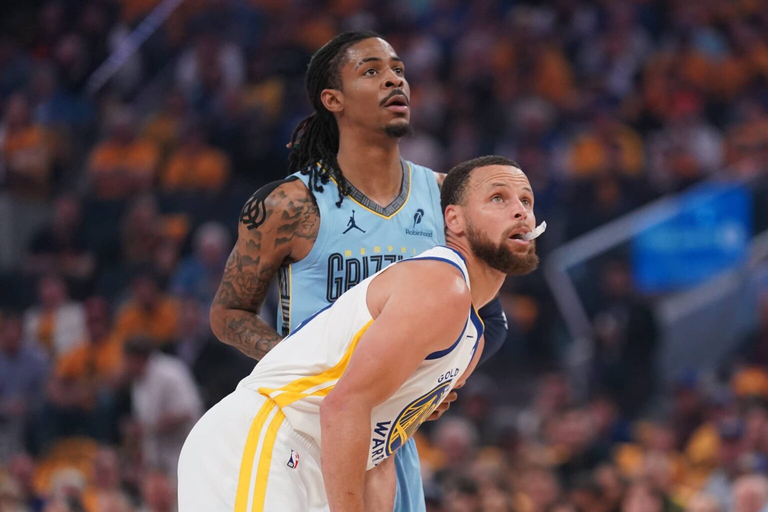Apr 15, 2025; San Francisco, California, USA; Golden State Warriors guard Stephen Curry (30) stands in front of Memphis Grizzlies guard Ja Morant (12) during a jump ball in the first quarter at the Chase Center. Mandatory Credit: Cary Edmondson-Imagn Images