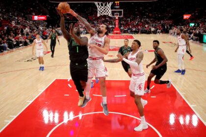Jan 18, 2026; Houston, Texas, USA; New Orleans Pelicans forward Zion Williamson (1) shoots against Houston Rockets center Steven Adams (12) during the second quarter at Toyota Center. Mandatory Credit: Erik Williams-Imagn Images