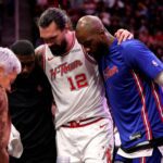 Jan 18, 2026; Houston, Texas, USA; Houston Rockets center Steven Adams (12) is helped off the court after an injury against the New Orleans Pelicans during the fourth quarter at Toyota Center. Mandatory Credit: Erik Williams-Imagn Images