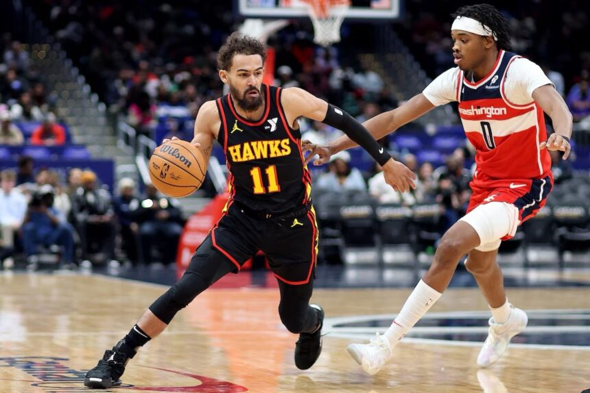 Feb 8, 2025; Washington, District of Columbia, USA; Atlanta Hawks guard Trae Young (11) drives past Washington Wizards guard Bilal Coulibaly (0) during the first half at Capital One Arena. Mandatory Credit: Daniel Kucin Jr.-Imagn Images