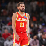 Dec 27, 2025; Atlanta, Georgia, USA; Atlanta Hawks guard Trae Young (11) in action against the New York Knicks in the fourth quarter at State Farm Arena. Mandatory Credit: Brett Davis-Imagn Images