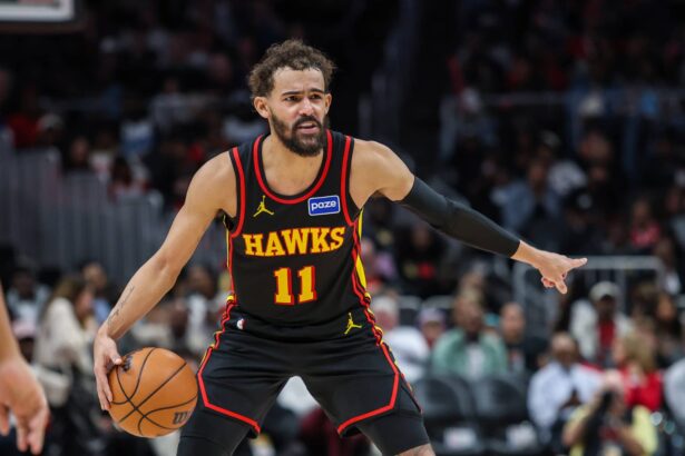 Dec 26, 2025; Atlanta, Georgia, USA; Atlanta Hawks guard Trae Young (11) points to teammates during the game against the Miami Heat during the third quarter at State Farm Arena. Mandatory Credit: Jordan Godfree-Imagn Images