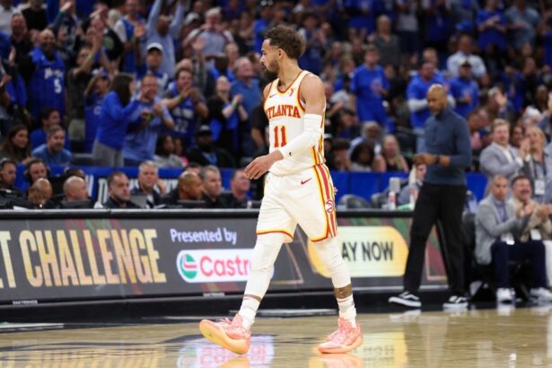 Apr 15, 2025; Orlando, Florida, USA; Atlanta Hawks guard Trae Young (11) reacts after given a technical foul against the Orlando Magic in the fourth quarter at Kia Center. Mandatory Credit: Nathan Ray Seebeck-Imagn Images