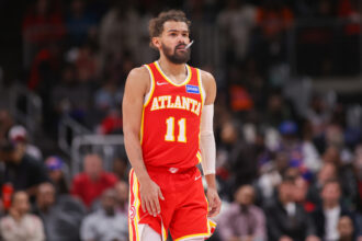 Dec 27, 2025; Atlanta, Georgia, USA; Atlanta Hawks guard Trae Young (11) in action against the New York Knicks in the fourth quarter at State Farm Arena. Mandatory Credit: Brett Davis-Imagn Images