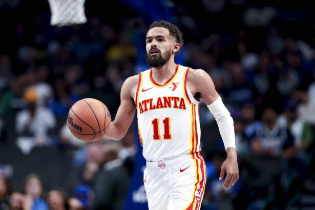 Apr 2, 2025; Dallas, Texas, USA; Atlanta Hawks guard Trae Young (11) dribbles against the Dallas Mavericks during the second half at American Airlines Center. Mandatory Credit: Kevin Jairaj-Imagn Images