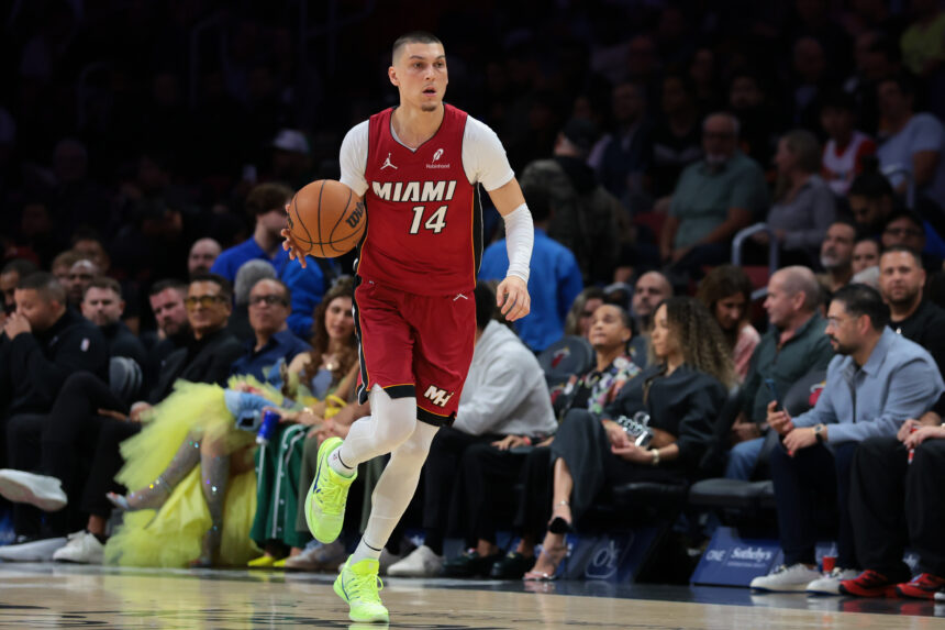 Jan 13, 2026; Miami, Florida, USA; Miami Heat guard Tyler Herro (14) dribbles the basketball against the Phoenix Suns during the first quarter at Kaseya Center. Mandatory Credit: Sam Navarro-Imagn Images