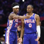 Jan 5, 2026; Philadelphia, Pennsylvania, USA; Philadelphia 76ers guard Vj Edgecombe (77) and guard Tyrese Maxey (0) talk during the third quarter against the Denver Nuggets at Xfinity Mobile Arena. Mandatory Credit: Bill Streicher-Imagn Images