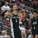 Jan 28, 2026; Houston, Texas, USA; San Antonio Spurs forward Victor Wembanyama (1) and guard Stephon Castle (5) react after a play during the fourth quarter against the Houston Rockets at Toyota Center. Mandatory Credit: Troy Taormina-Imagn Images