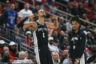 Jan 28, 2026; Houston, Texas, USA; San Antonio Spurs forward Victor Wembanyama (1) and guard Stephon Castle (5) react after a play during the fourth quarter against the Houston Rockets at Toyota Center. Mandatory Credit: Troy Taormina-Imagn Images