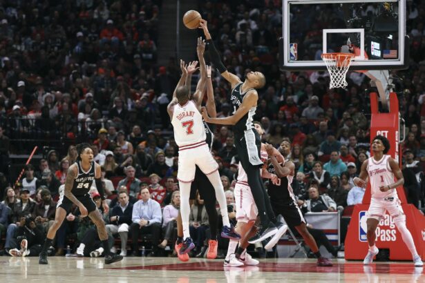Jan 28, 2026; Houston, Texas, USA; San Antonio Spurs forward Victor Wembanyama (1) blocks a shot by Houston Rockets forward Kevin Durant (7) during the fourth quarter at Toyota Center. Mandatory Credit: Troy Taormina-Imagn Images