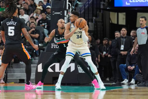 Jan 15, 2026; San Antonio, Texas, USA; Milwaukee Bucks forward Giannis Antetokounmpo (34) backs up against San Antonio Spurs forward/center Victor Wembanyama (1) in the first half at Frost Bank Center. Mandatory Credit: Daniel Dunn-Imagn Images