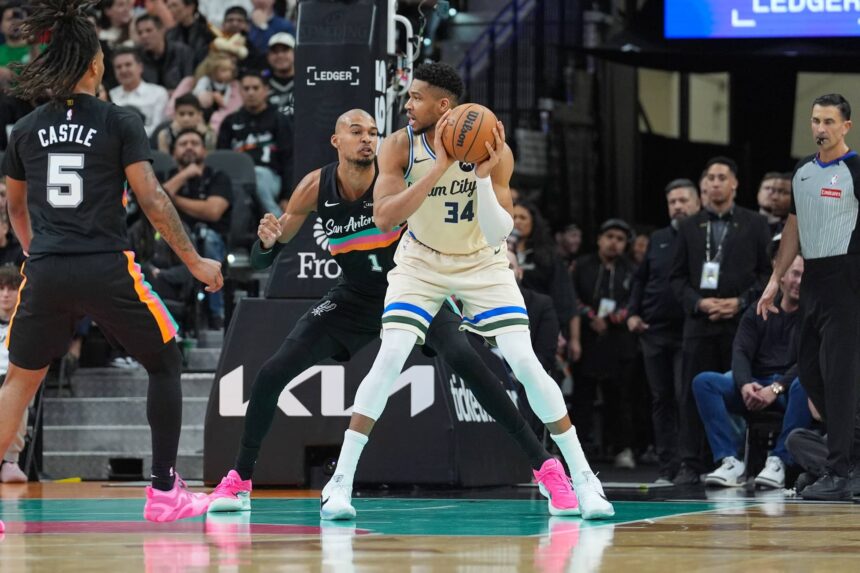 Jan 15, 2026; San Antonio, Texas, USA; Milwaukee Bucks forward Giannis Antetokounmpo (34) backs up against San Antonio Spurs forward/center Victor Wembanyama (1) in the first half at Frost Bank Center. Mandatory Credit: Daniel Dunn-Imagn Images