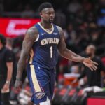 Jan 7, 2026; Atlanta, Georgia, USA; New Orleans Pelicans forward Zion Williamson (1) reacts on his way to the bench during a timeout against the Atlanta Hawks during the first half at State Farm Arena. Mandatory Credit: Dale Zanine-Imagn Images