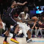Jan 4, 2026; Miami, Florida, USA; New Orleans Pelicans forward Zion Williamson (1) drives to the basket as Miami Heat forward Andrew Wiggins (22) defends during the second half at Kaseya Center. Mandatory Credit: Jim Rassol-Imagn Images