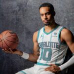 Charlotte, North Carolina, USA; Charlotte Hornets Amari Bailey (10) poses for a photo during Charlotte Hornets Media Day at the Spectrum Center. Mandatory Credit: Jim Dedmon-Imagn Images