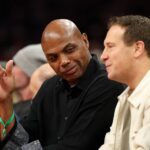 Phoenix, Arizona, USA; Phoenix Suns former player Charles Barkley (left) and team owner Mat Ishbia sit courtside against the Minnesota Timberwolves during an NBA Cup game at Mortgage Matchup Center. Mandatory Credit: Mark J. Rebilas-Imagn Images