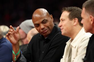Phoenix, Arizona, USA; Phoenix Suns former player Charles Barkley (left) and team owner Mat Ishbia sit courtside against the Minnesota Timberwolves during an NBA Cup game at Mortgage Matchup Center. Mandatory Credit: Mark J. Rebilas-Imagn Images