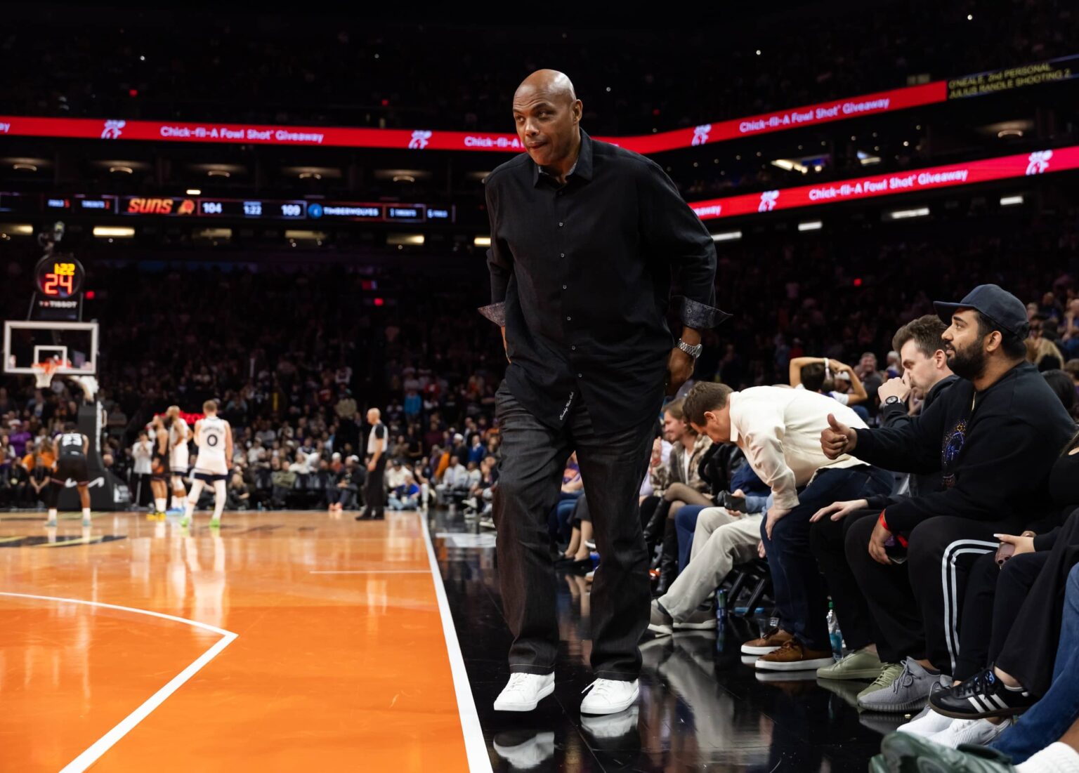 Phoenix, Arizona, USA; Phoenix Suns former player Charles Barkley walks off the court in the fourth quarter against the Minnesota Timberwolves during an NBA Cup game at Mortgage Matchup Center. Mandatory Credit: Mark J. Rebilas-Imagn Images
