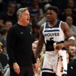 Phoenix, Arizona, USA; Minnesota Timberwolves head coach Chris Finch with guard Anthony Edwards (5) against the Phoenix Suns during an NBA Cup game at Mortgage Matchup Center. Mandatory Credit: Mark J. Rebilas-Imagn Images