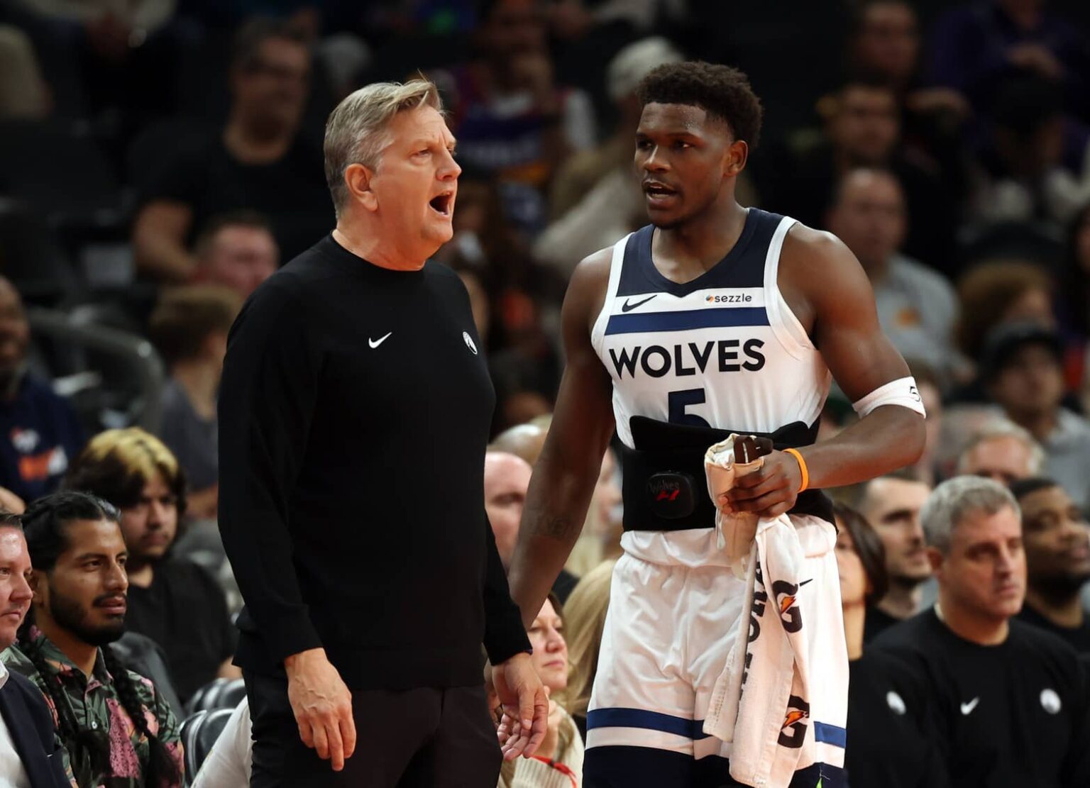 Phoenix, Arizona, USA; Minnesota Timberwolves head coach Chris Finch with guard Anthony Edwards (5) against the Phoenix Suns during an NBA Cup game at Mortgage Matchup Center. Mandatory Credit: Mark J. Rebilas-Imagn Images