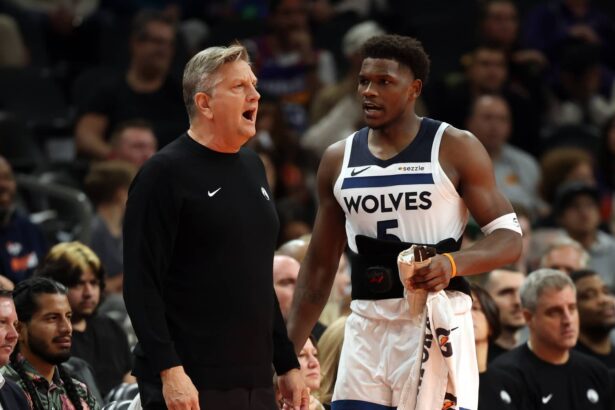 Phoenix, Arizona, USA; Minnesota Timberwolves head coach Chris Finch with guard Anthony Edwards (5) against the Phoenix Suns during an NBA Cup game at Mortgage Matchup Center. Mandatory Credit: Mark J. Rebilas-Imagn Images