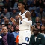 Memphis, Tennessee, USA; Memphis Grizzlies guard Ja Morant (12) reacts during the third quarter against the Houston Rockets at FedExForum. Mandatory Credit: Petre Thomas-Imagn Images