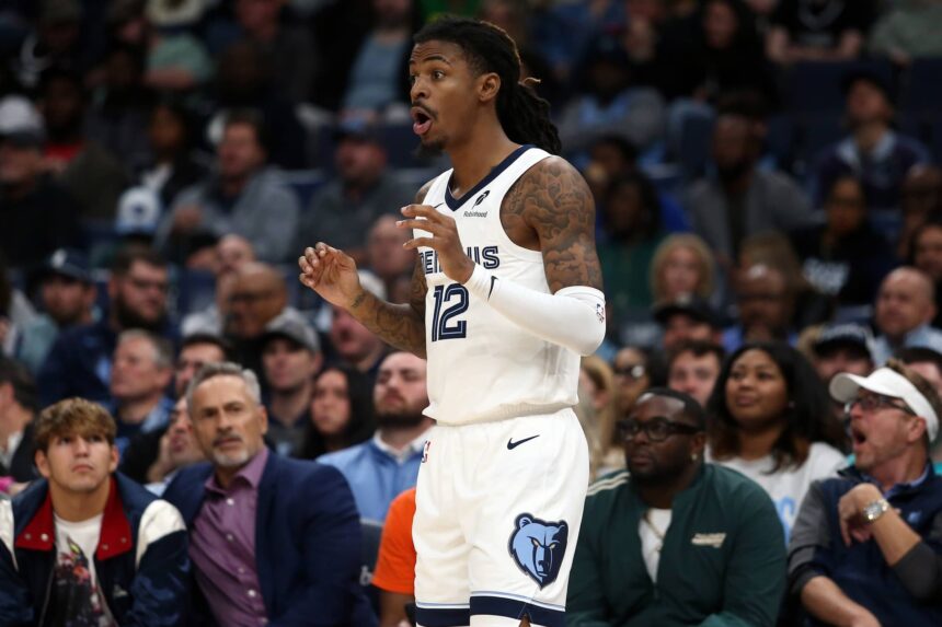 Memphis, Tennessee, USA; Memphis Grizzlies guard Ja Morant (12) reacts during the third quarter against the Houston Rockets at FedExForum. Mandatory Credit: Petre Thomas-Imagn Images