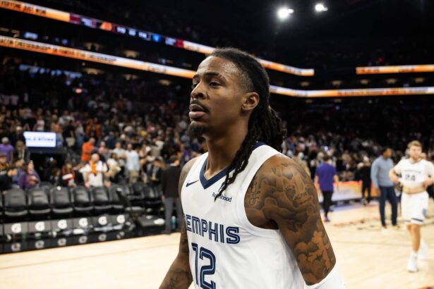 Phoenix, Arizona, USA; Memphis Grizzlies guard Ja Morant (12) against the Phoenix Suns at the Mortgage Matchup Center. Mandatory Credit: Mark J. Rebilas-Imagn Images