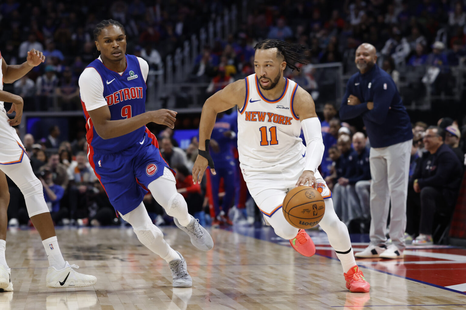 Jan 5, 2026; Detroit, Michigan, USA; New York Knicks guard Jalen Brunson (11) dribbles on Detroit Pistons guard Ausar Thompson (9) in the first half at Little Caesars Arena. Mandatory Credit: Rick Osentoski-Imagn Images
