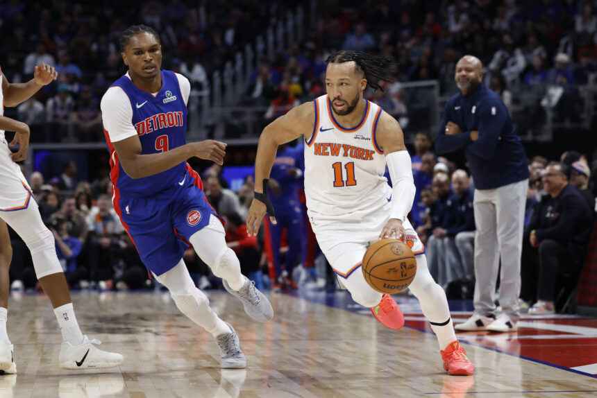 Jan 5, 2026; Detroit, Michigan, USA; New York Knicks guard Jalen Brunson (11) dribbles on Detroit Pistons guard Ausar Thompson (9) in the first half at Little Caesars Arena. Mandatory Credit: Rick Osentoski-Imagn Images