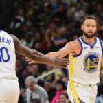 Milwaukee, Wisconsin, USA; Golden State Warriors guard Stephen Curry (30) reacts with forward Jimmy Butler (10) after scoring a basket in the 3rd quarter against the Milwaukee Bucks at Fiserv Forum. Mandatory Credit: Benny Sieu-Imagn Images