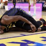 Jan 19, 2026; San Francisco, California, USA; Golden State Warriors forward Jimmy Butler III (10) holds his right knee as he goes down with an injury during the third quarter against the Miami Heat at Chase Center. Mandatory Credit: Kelley L Cox-Imagn Images