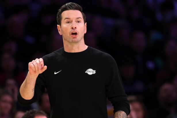 Los Angeles, California, USA; Los Angeles Lakers Head Coach JJ Redick reacts to a play during the fourth quarter against the Memphis Grizzlies at Crypto.com Arena. Mandatory Credit: Kiyoshi Mio-Imagn Images