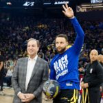 San Francisco, California, USA; Golden State Warriors CEO Joe Lacob presents guard Stephen Curry (30) with the 2024 NBA All-Star ball before the game against the Phoenix Suns at Chase Center. Mandatory Credit: John Hefti-Imagn Images