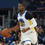 San Francisco, California, USA; Golden State Warriors forward Jonathan Kuminga (1) looks to pass against the Toronto Raptors in the second quarter at Chase Center. Mandatory Credit: David Gonzales-Imagn Images