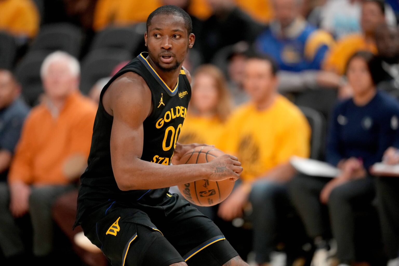 San Francisco, California, USA; Golden State Warriors forward Jonathan Kuminga (00) holds onto the ball against the Minnesota Timberwolves in the fourth quarter during game four of the second round for the 2025 NBA Playoffs at Chase Center. Mandatory Credit: Cary Edmondson-Imagn Images