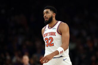 Phoenix, Arizona, USA; New York Knicks center Karl-Anthony Towns (32) reacts against the Phoenix Suns in the first half at Mortgage Matchup Center. Mandatory Credit: Mark J. Rebilas-Imagn Images