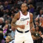 Sacramento, California, USA; Los Angeles Clippers forward Kawhi Leonard (2) reacts after making a three point basket against the Sacramento Kings during the second quarter at Golden 1 Center. Mandatory Credit: Darren Yamashita-Imagn Images