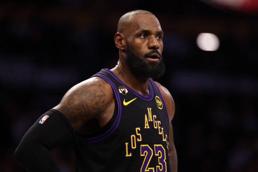Los Angeles, California, USA; Los Angeles Lakers forward LeBron James (23) wears a patch affixed to the upper right chest to celebrate his record-setting 23rd NBA season during the first half against the Atlanta Hawks at Crypto.com Arena. Mandatory Credit: Kiyoshi Mio-Imagn Images