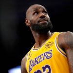 Sacramento, California, USA; Los Angeles Lakers forward LeBron James (23) walks towards the team bench during a break in the action against the Sacramento Kings in the third quarter at the Golden 1 Center. Mandatory Credit: Cary Edmondson-Imagn Images