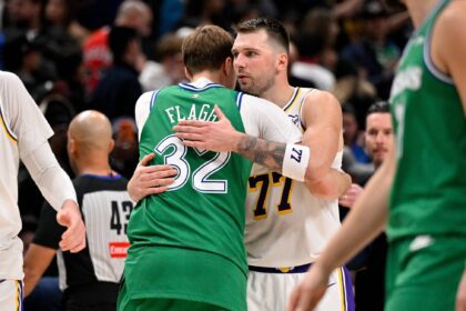 Dallas, Texas, USA; Dallas Mavericks forward Cooper Flagg (32) hugs Los Angeles Lakers guard Luka Doncic (77) after the game at the American Airlines Center. Mandatory Credit: Jerome Miron-Imagn Images