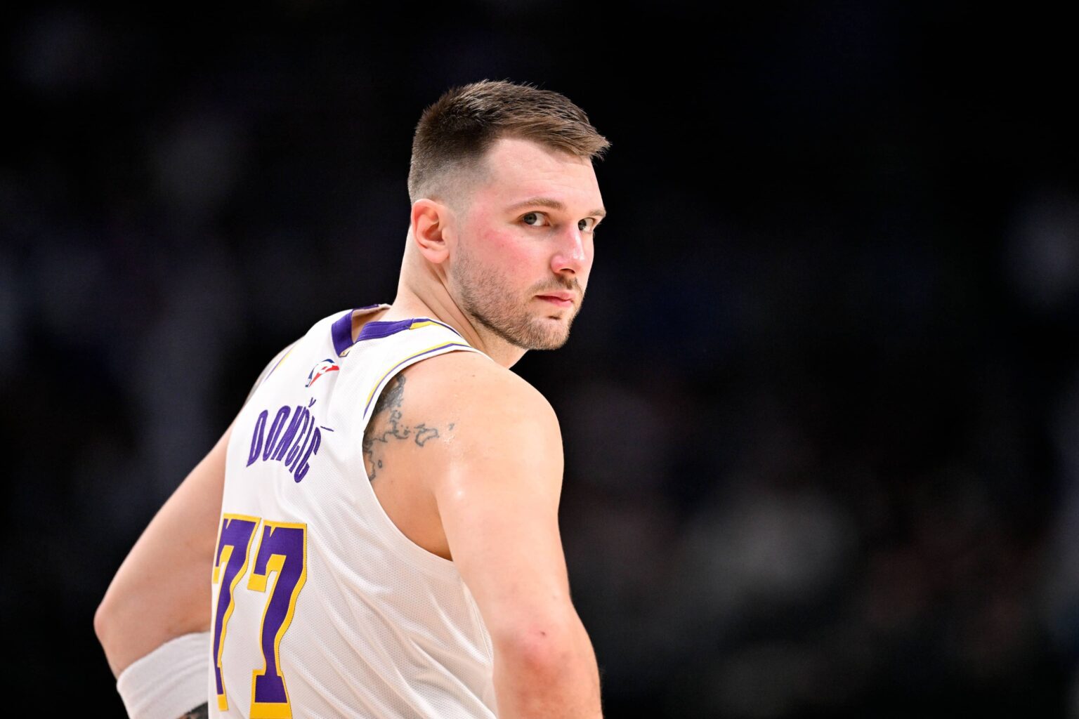Dallas, Texas, USA; Los Angeles Lakers guard Luka Doncic (77) looks back during the second half against the Dallas Mavericks at the American Airlines Center. Mandatory Credit: Jerome Miron-Imagn Images