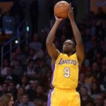 Los Angeles, CA, USA; Los Angeles Lakers forward Luol Deng (9) shoots against the San Antonio Spurs during the first half at Staples Center. Mandatory Credit: Gary A. Vasquez-Imagn Images