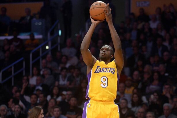 Los Angeles, CA, USA; Los Angeles Lakers forward Luol Deng (9) shoots against the San Antonio Spurs during the first half at Staples Center. Mandatory Credit: Gary A. Vasquez-Imagn Images