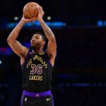 Los Angeles, California, USA; Los Angeles Lakers guard Marcus Smart (36) shoots against the Detroit Pistons during the second half at Crypto.com Arena. Mandatory Credit: Gary A. Vasquez-Imagn Images