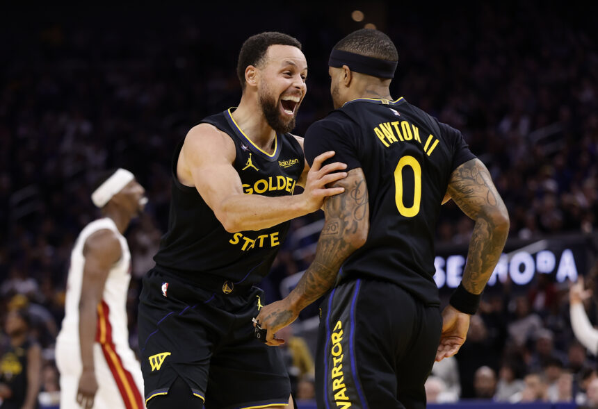 Jan 19, 2026; San Francisco, California, USA; Golden State Warriors guard Stephen Curry (30) celebrates with guard Gary Payton II (0) after Payton scored a basket against the Miami Heat during the third quarter at Chase Center. Mandatory Credit: Kelley L Cox-Imagn Images