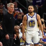 Phoenix, Arizona, USA; Golden State Warriors guard Stephen Curry (30) reacts alongside head coach Steve Kerr against the Phoenix Suns in the second half at Mortgage Matchup Center. Mandatory Credit: Mark J. Rebilas-Imagn Images